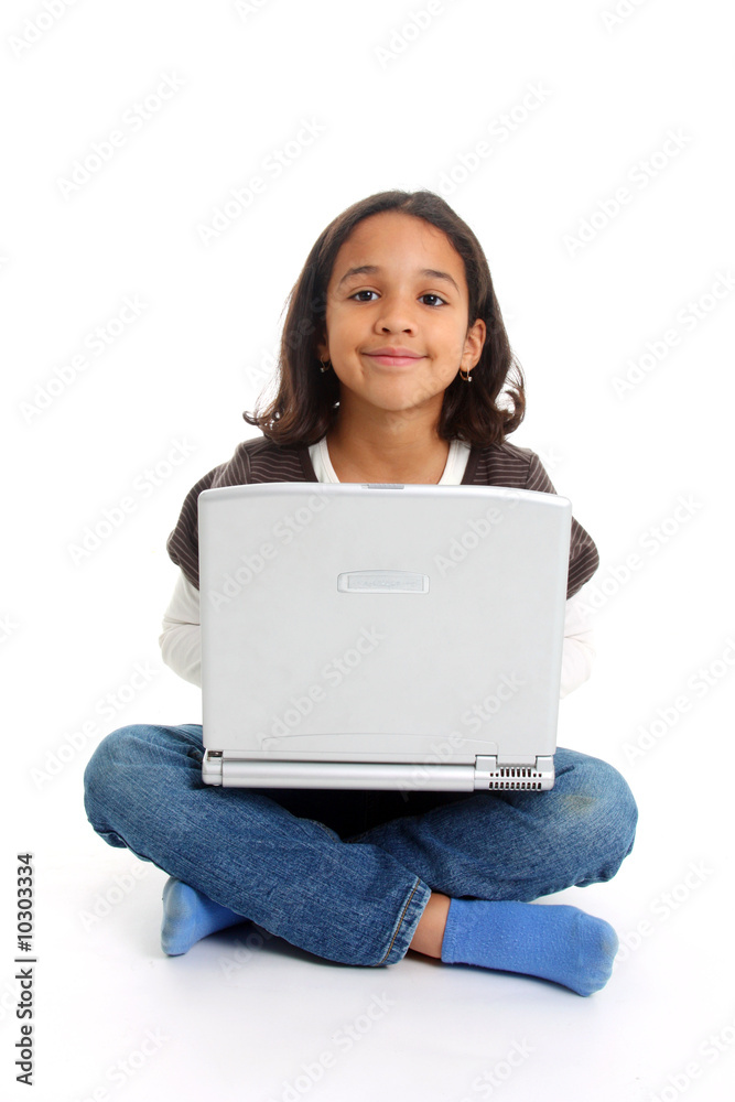 Mixed Race girl on floor with a computer Mixed Race girl on floor with a computer