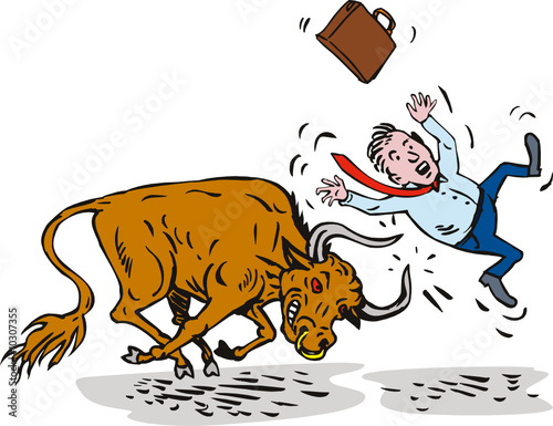 Bull attacking businessman
