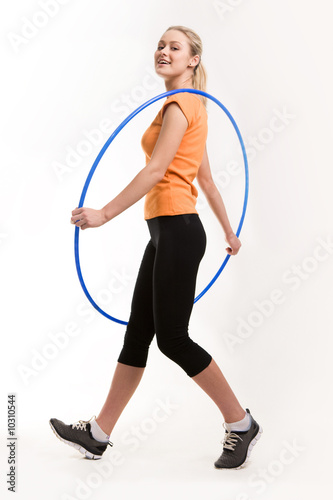 Photo of positive female holding blue hoop