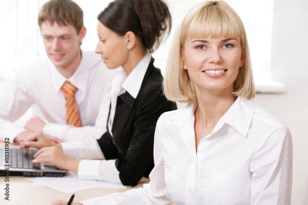 Portrait of pretty blonde sitting at workplace Portrait of pretty blonde sitting at workplace