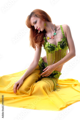 beautiful sad girl sitting isolated on a white