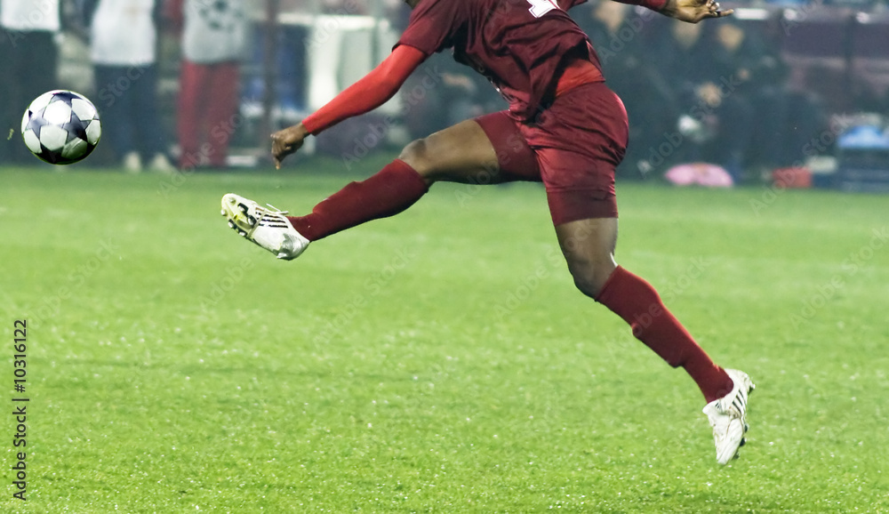 Fototapeta premium Soccer player running after the ball