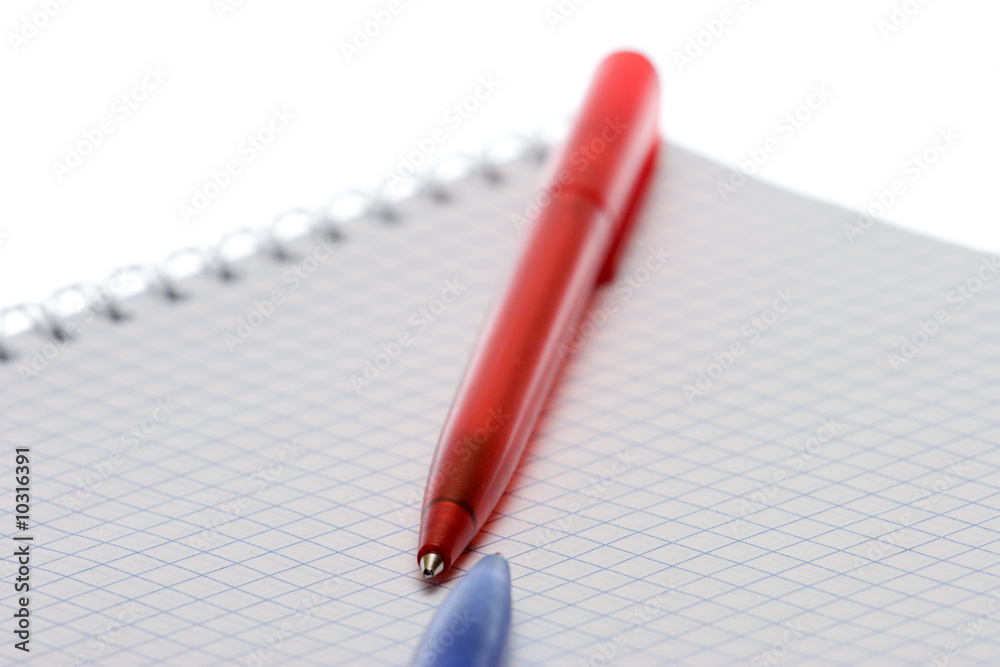 Pen and paper on a white background Pen and paper on a white background