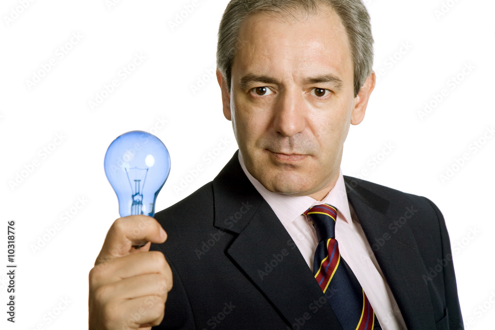 mature business man with a lamp isolated on white mature business man with a lamp isolated on white