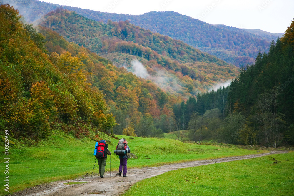 An image of two touristes on a road