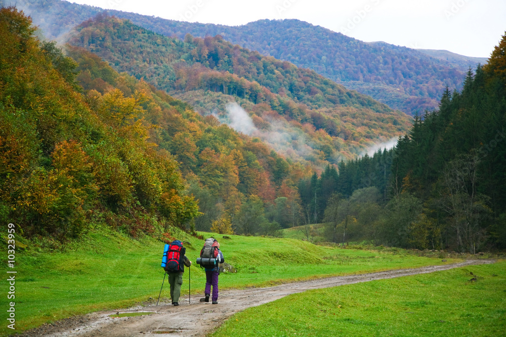 An image of two touristes on a road An image of two touristes on a road
