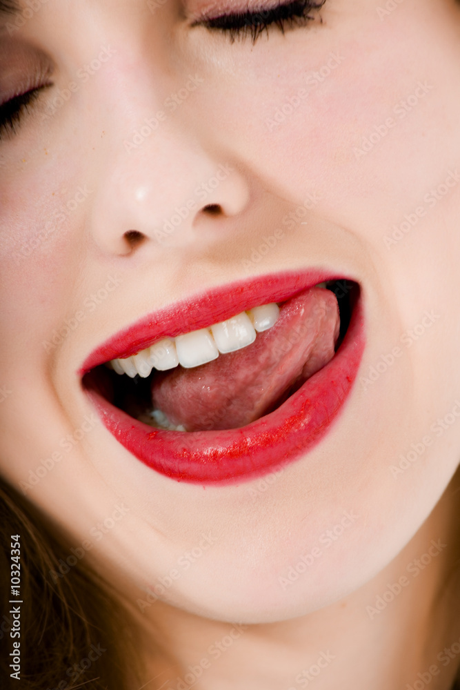 Obraz premium Smile of a beautiful young woman on white background