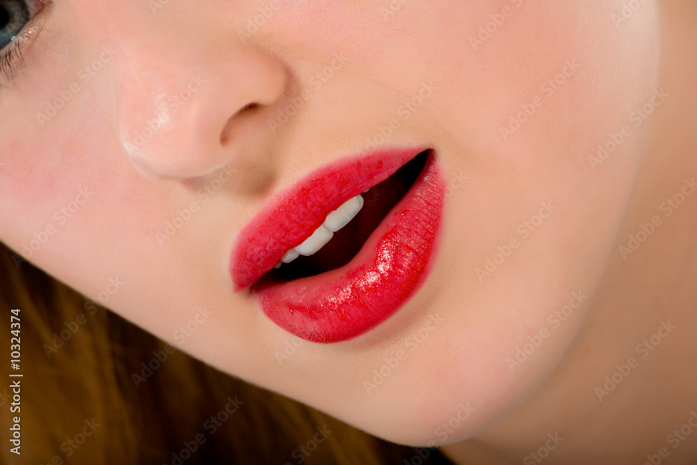 Fototapeta premium Smile of a beautiful young woman on white background