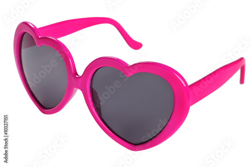 Pink plastic glasses heart on white background