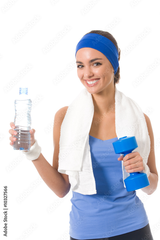 Woman in sportswear with bottle of water and dumbbell