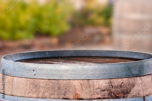 Winery scene with an old oak wine barrel