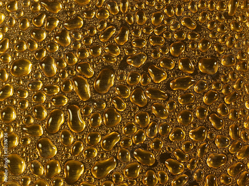 water drops on a gold surface