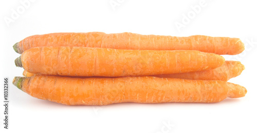 Carrots orange pile isolated on white background