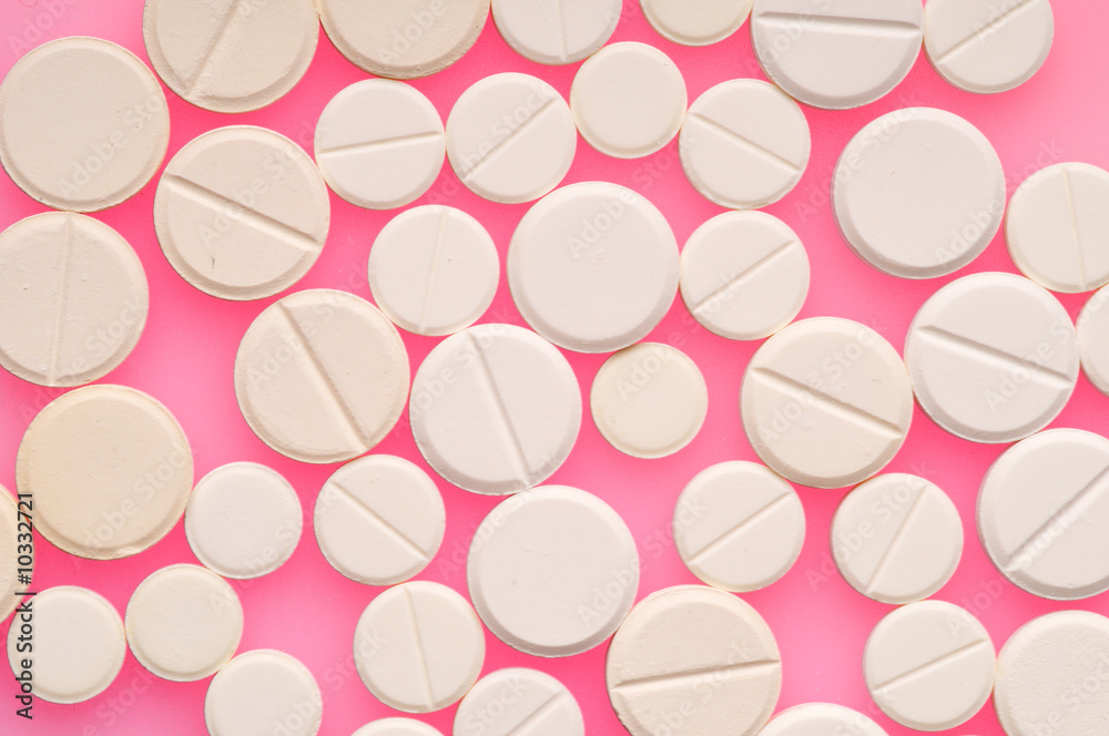 Some pills over color background