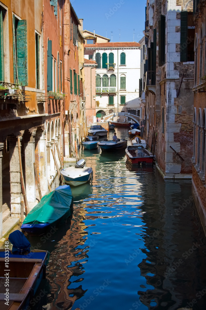 A typical canal in Venice and a bridge