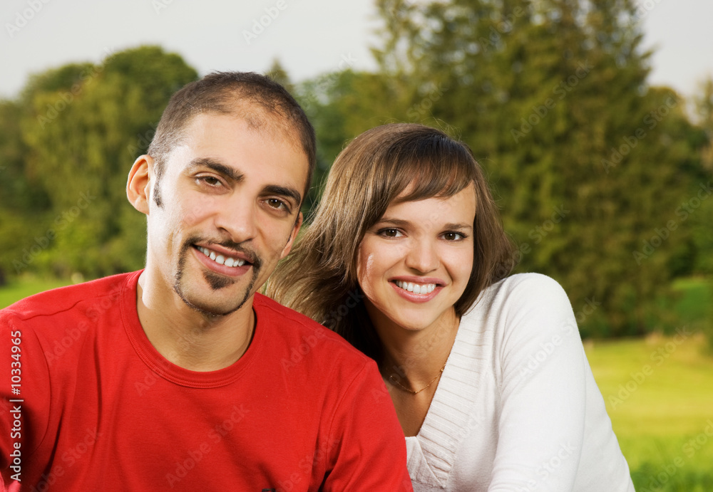 Young couple in love outdoors. Close-up portrait
