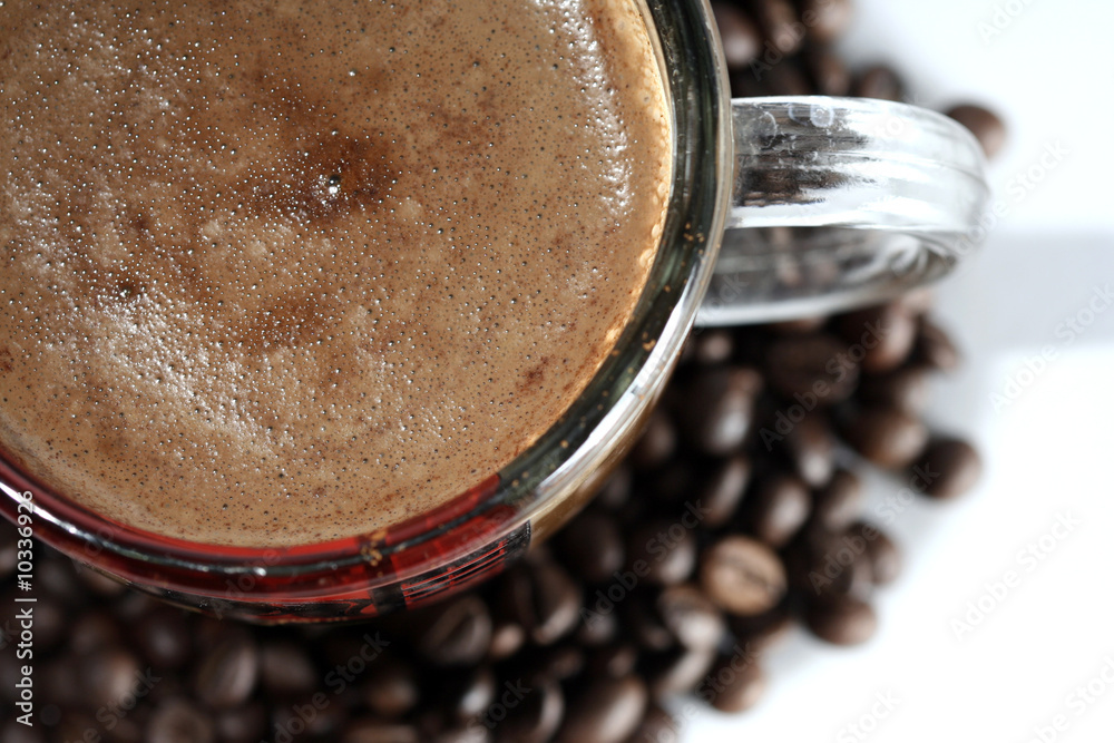 Cup with coffee, costing on coffee grain. Cup with coffee, costing on coffee grain.