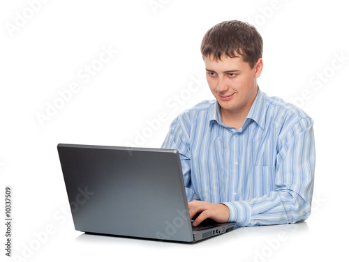 young adult businessman working with laptop