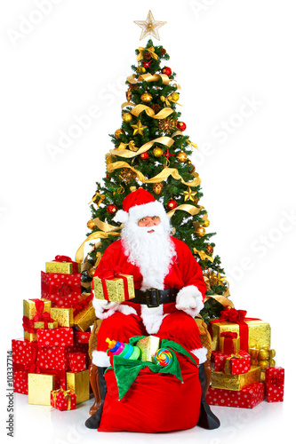 Smiling Santa and Christmas Tree. Over white background. © grinny