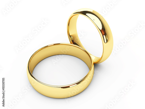 Wedding golden rings one over another. Isolated.
