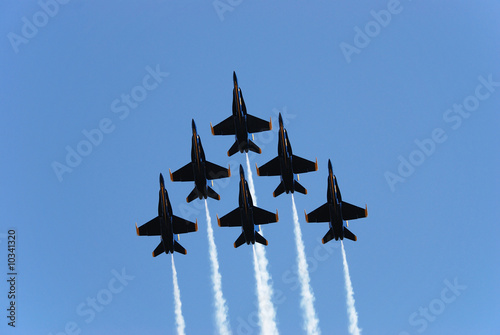 a formation of airplanes on a blue sky