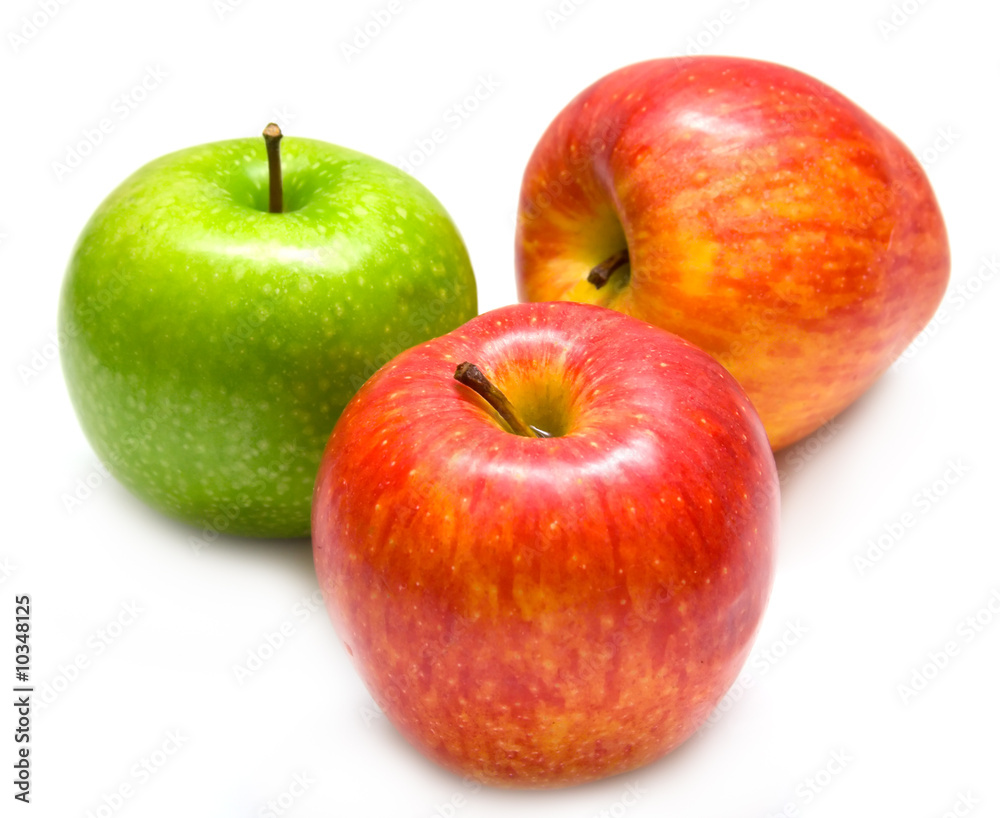 The green and red apples on white. Isolation, shallow DOF. The green and red apples on white. Isolation, shallow DOF.