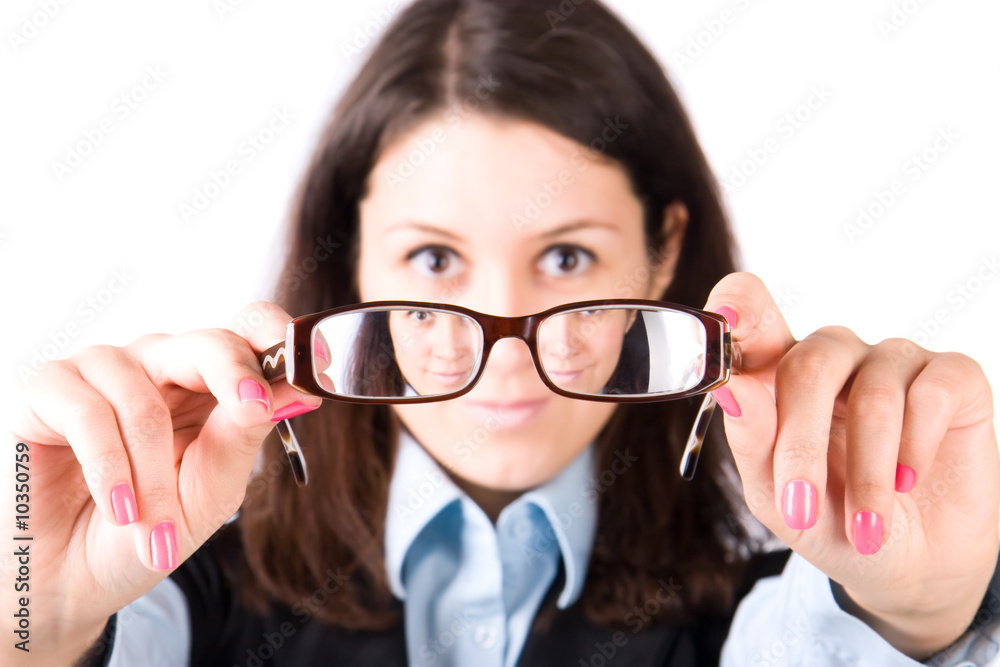 Young woman looking through eyeglasses. Isolated on white. Young woman looking through eyeglasses. Isolated on white.