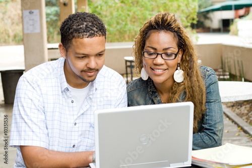 two african college students study computer