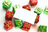 Blank card on red and green gifts