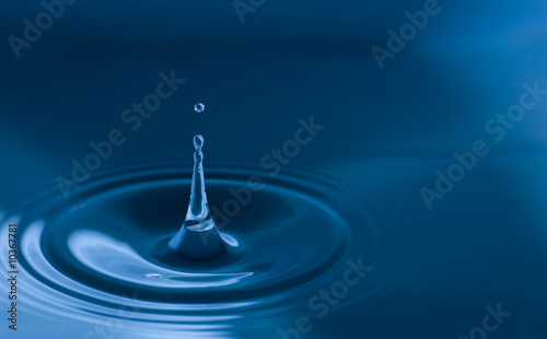 Water droplets close up in blue