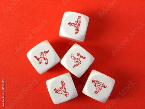 Erotic dices on red background photo