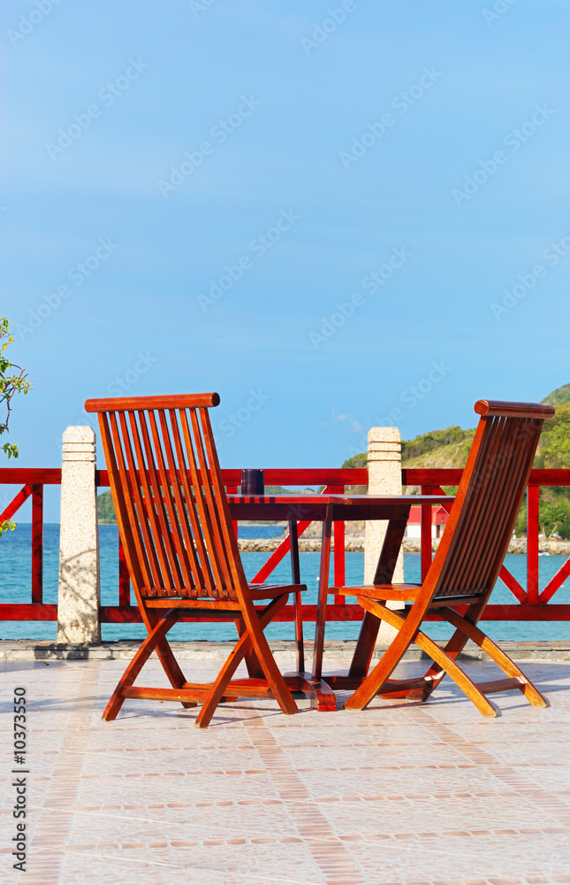 A patio and chairs in tropical resort A patio and chairs in tropical resort