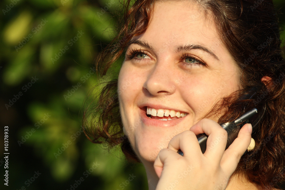 Woman on a phone smiling Woman on a phone smiling