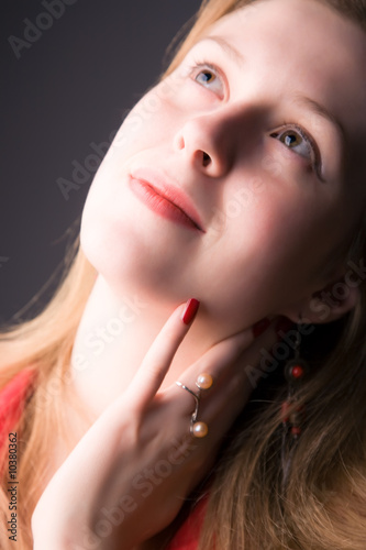 Young woman soft portrait. On dark background.