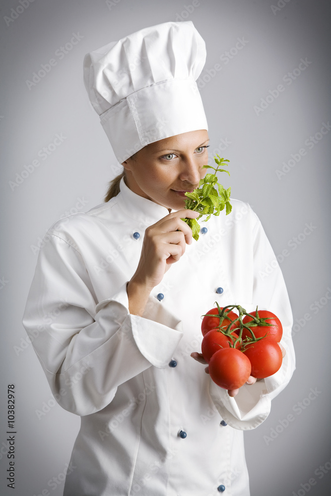 female chef with fresh, natural ingredients female chef with fresh, natural ingredients