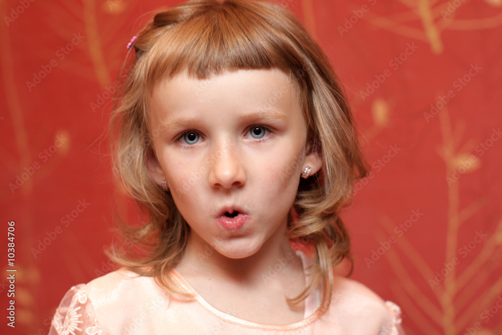 A girl makes a grimace at home A girl makes a grimace at home