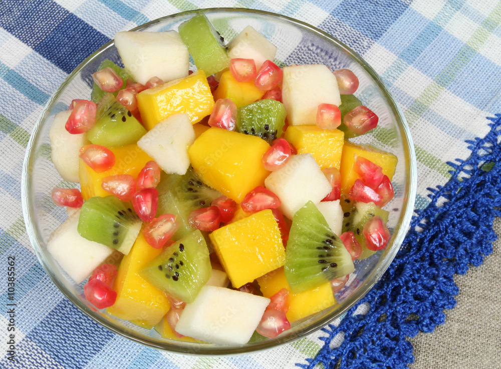 Fruit salad with kiwi, mango, pear and pomegranate Fruit salad with kiwi, mango, pear and pomegranate