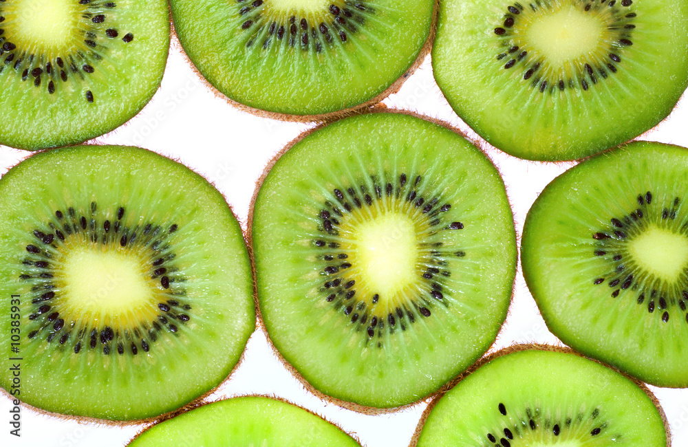 Green kiwi macro sliced cuts isolated on white (food background) Green kiwi macro sliced cuts isolated on white (food background)