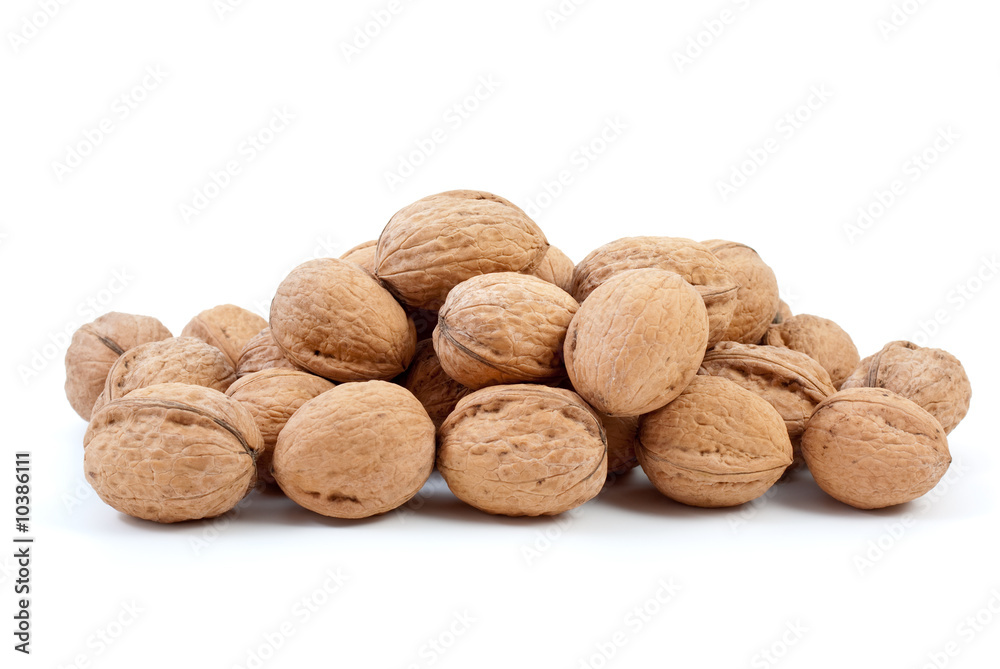 Small pile of walnuts isolated on the white background Small pile of walnuts isolated on the white background