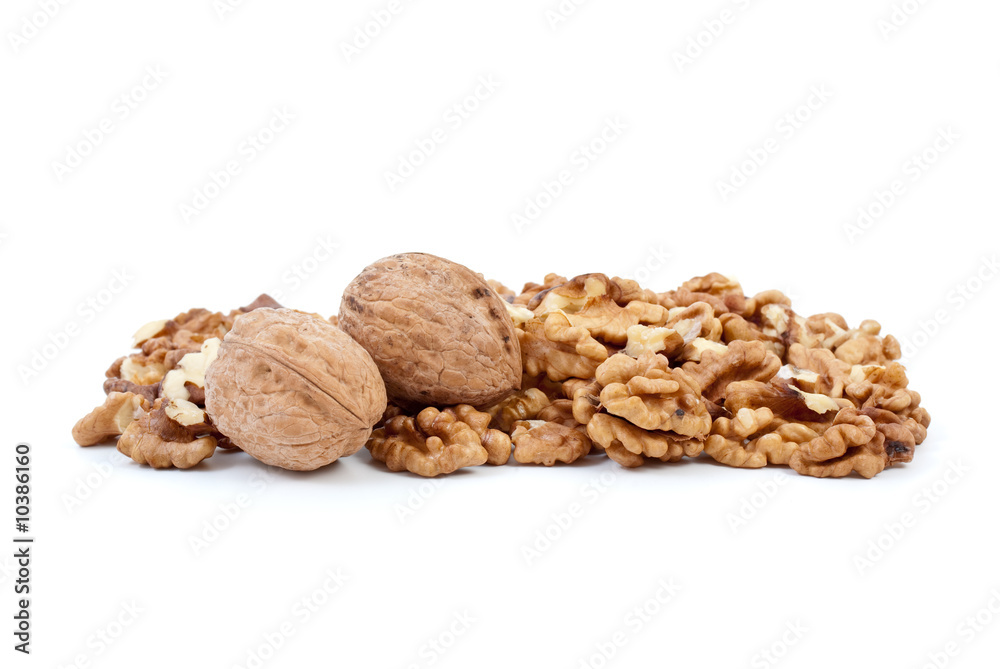 Two walnuts and some kernels isolated on the white background Two walnuts and some kernels isolated on the white background