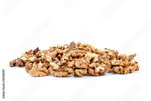 Small pile of walnuts kernels isolated on the white background