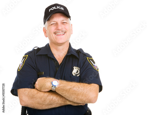 Happy, laughing police officer.  Isolated on white.