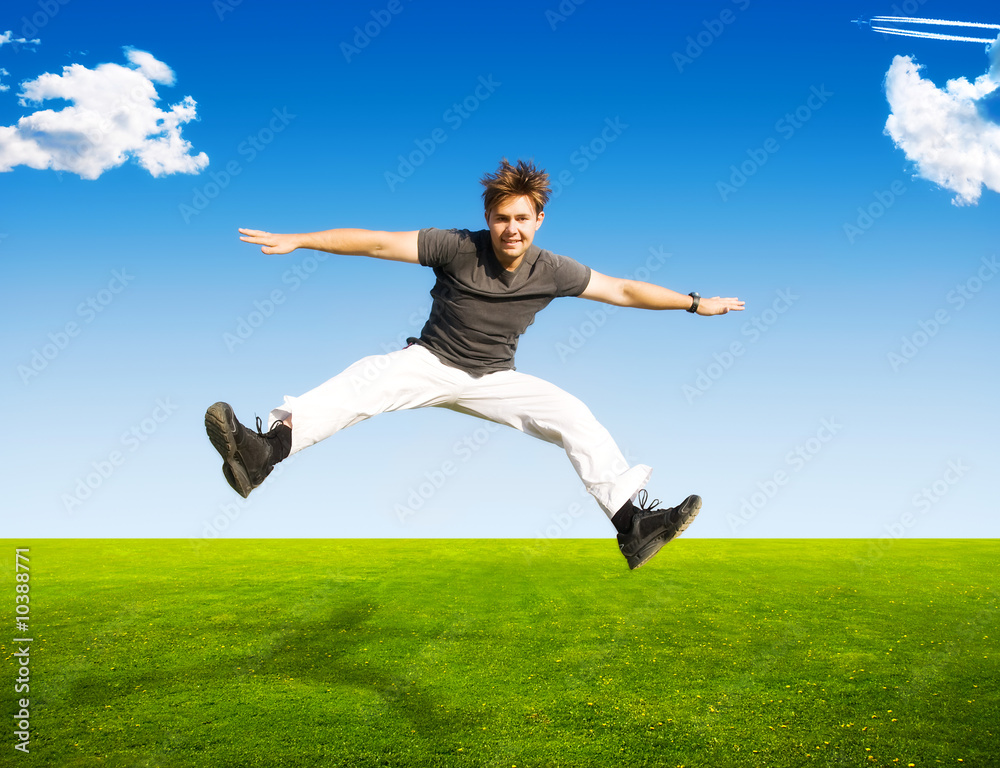 Happy jumping man on summer landscape background. Happy jumping man on summer landscape background.