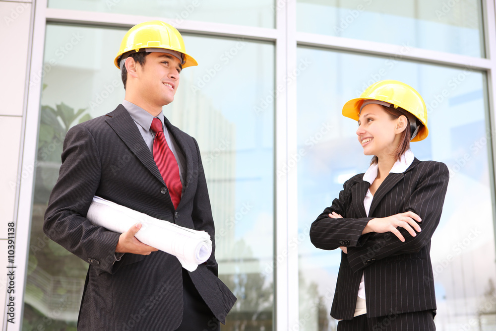 An attractive business team working construction building site An attractive business team working construction building site