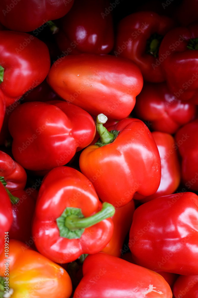 A bluk bin of peppers at an outdoor market A bluk bin of peppers at an outdoor market