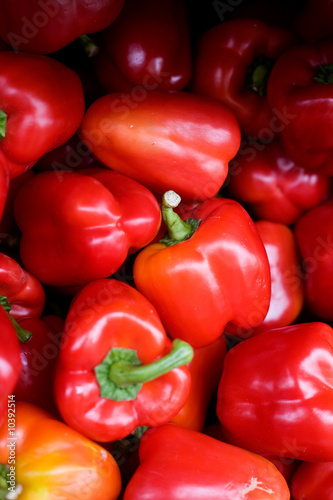 A bluk bin of peppers at an outdoor market
