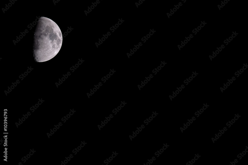 Moon isolated against black night sky with copyspace Moon isolated against black night sky with copyspace