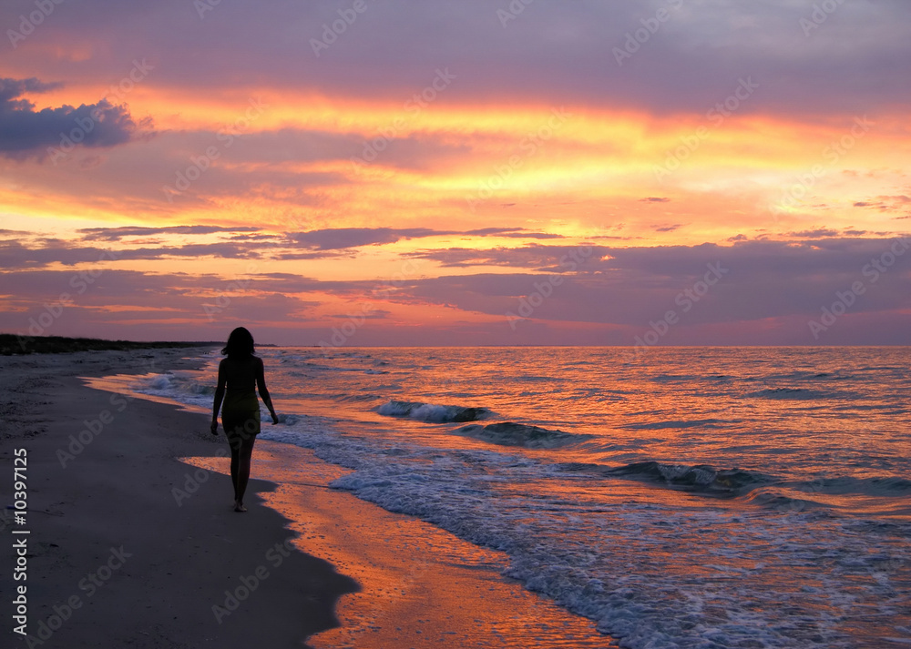 Beautiful young woman silhouette on sunset background Beautiful young woman silhouette on sunset background