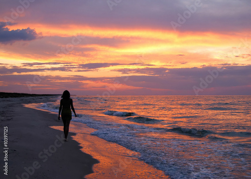 Beautiful young woman silhouette on sunset background © SJ Travel Footage