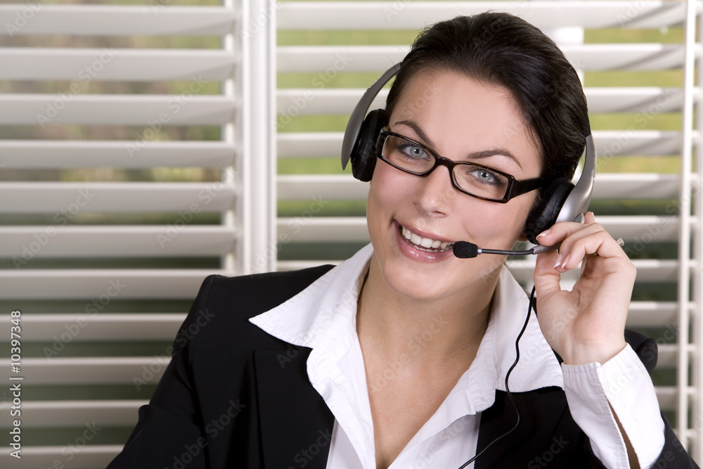 pretty business woman wearing headhset and the glasses pretty business woman wearing headhset and the glasses